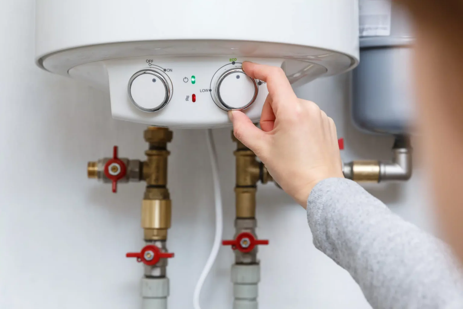 Technician adjusting a water heater in Redondo Beach